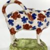 71867A4F-5AA3-437F-8822-ABA9F5E75969 Swansea pottery cow creamer, c. 1820. Legs