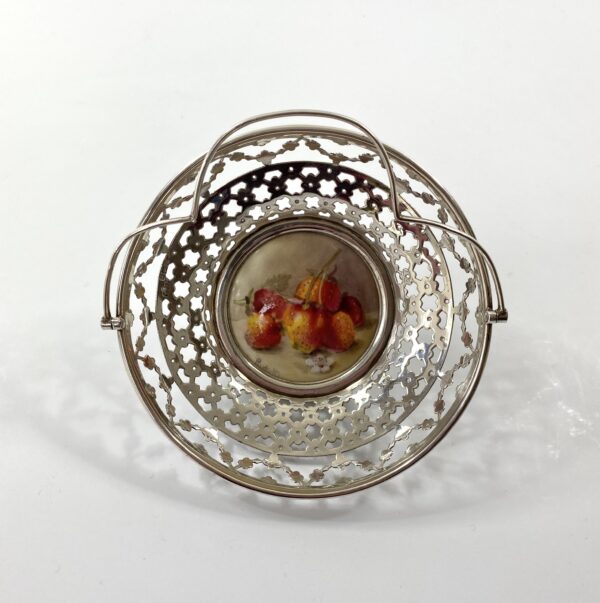 A7EADA99-AF23-4FB7-808A-161DA948938D Royal Worcester silver mounted basket, painted by Ricketts, dated 1912.