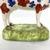 DCEB3F82-F2E7-45B3-AF16-0C54E3EEFADC Swansea pottery cow creamer, c. 1820. feet