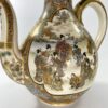Satsuma sake ewer. Ryozan Okamoto, Meiji Period. closeup people playing