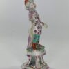 Bow porcelain figure of a Turkish Boy, c. 1760. blue and pink