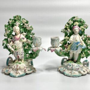 Pair Derby porcelain bocage candlesticks, c. 1765.